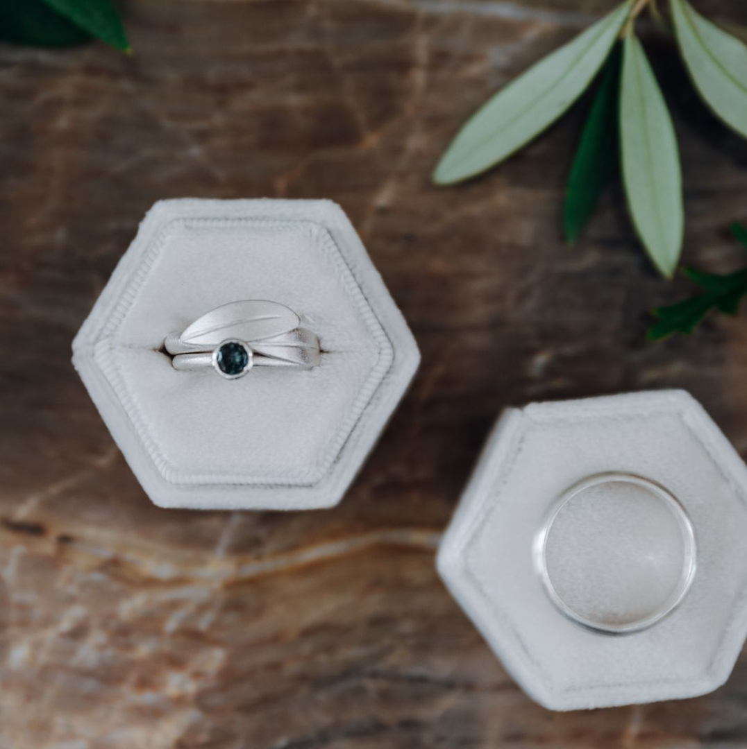 Bespoke handmade rings displayed in vintage ring boxes by Herefordshire jeweller Elizabeth Terzza